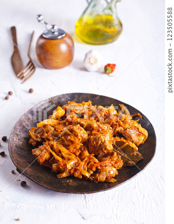 Stewed or braised cabbage served on dark plate Stewed or braised cabbage served on dark plate 123505588