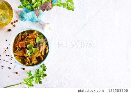 Baked vegetable salad in a cermaic bowl over light background. Delicious healthy autumn or winter salad, seasonal food. 123505596