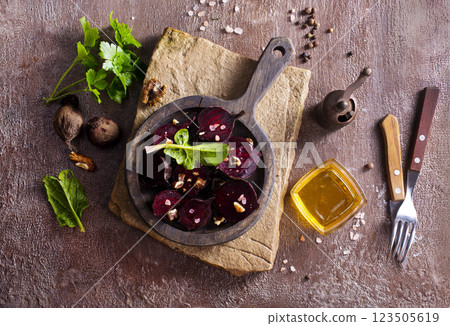 Fresh salad with boiled beet and nuts in the bowl Fresh salad with boiled beet and nuts in the bowl 123505619