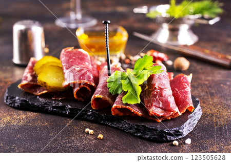 sliced smoked meat with red wine. The concept of cooking meat, 123505628