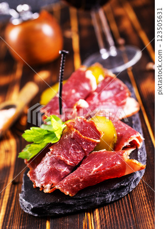 sliced smoked meat with red wine. The concept of cooking meat, sliced smoked meat with red wine. The concept of cooking meat, 123505631