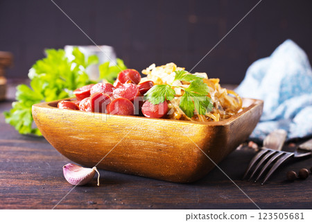 Homemade baked savoy cabbage with sausage. Rustic dish. Homemade baked savoy cabbage with sausage. Rustic dish. 123505681