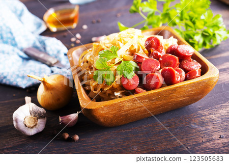 Homemade baked savoy cabbage with sausage. Rustic dish. Homemade baked savoy cabbage with sausage. Rustic dish. 123505683