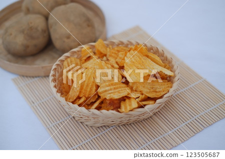 crispy French fries on a bamboo mat crispy French fries on a bamboo mat 123505687