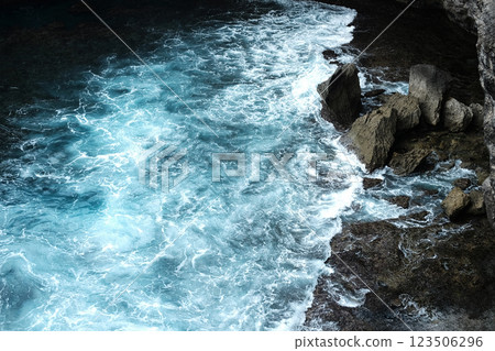 Beautiful landscape aerial view of surf and aqua surface in the sea with foam waves and splash water of ocean with rocky cliff beach Beautiful landscape aerial view of surf and aqua surface in the sea with foam waves and splash water of ocean with rocky cliff beach 123506296