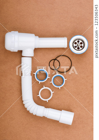Complete kit for assembling a sink drain with flexible tube and accessories. 123506343