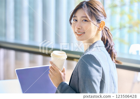 A young business woman working in a free address office A young business woman working in a free address office 123506428