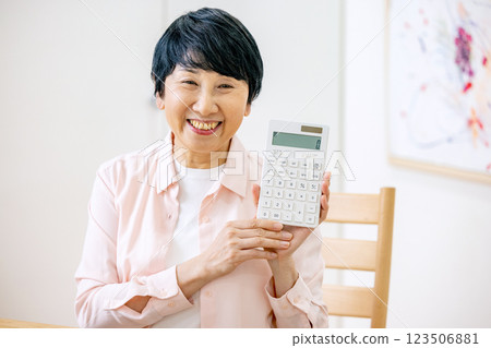 Senior woman looking at passbook Senior woman looking at passbook 123506881