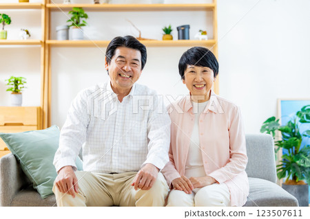 Senior couple relaxing in the living room Senior couple relaxing in the living room 123507611
