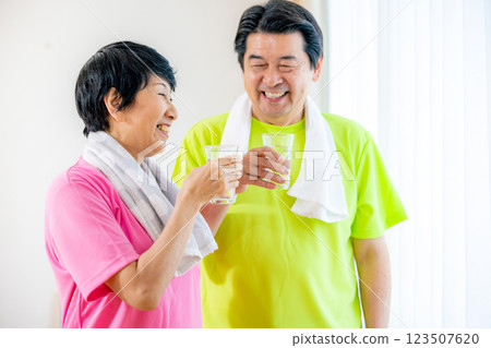 Senior couple rehydrating after exercise 123507620