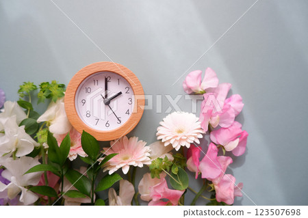 Flowers and clock and alarm clock, spring time 123507698