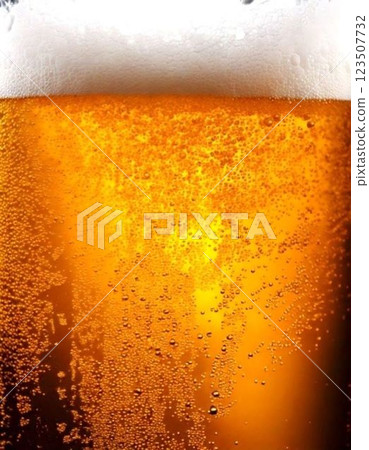 Draft beer poured into a glass 123507732