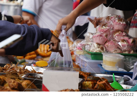 The atmosphere of the market selling cakes, food, and drinks for breaking the fast or Iftar during the month of Ramadan 123508222