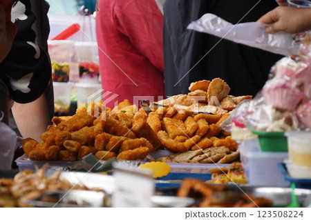 The atmosphere of the market selling cakes, food, and drinks for breaking the fast or Iftar during the month of Ramadan The atmosphere of the market selling cakes, food, and drinks for breaking the fast or Iftar during the month of Ramadan 123508224