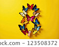 Creative card with Number 8 made from colorful butterflies beautifully displayed against a vibrant yellow background 123508372