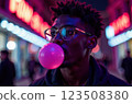 A cheerful young man in a colorful neon setting, joyfully enjoying bubblegum, radiating energy 123508380