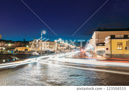 Helsinki, Finland. Night Traffic In Pohjoisesplanadi Street In Evening Or Night Illumination. Night stars shining above street Helsinki, Finland. Night Traffic In Pohjoisesplanadi Street In Evening Or Night Illumination. Night stars shining above street 123508533