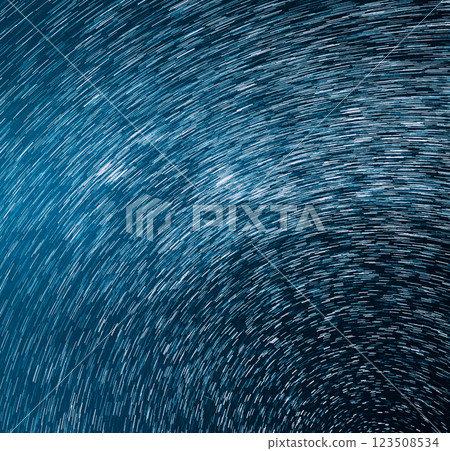Trails Of Stars. Bewitching Illusion Of Star Trails. Star And Meteoric Trails On Night Sky Background. Spin Of Unusual Amazing Stars Effect In Sky Trails Of Stars. Bewitching Illusion Of Star Trails. Star And Meteoric Trails On Night Sky Background. Spin Of Unusual Amazing Stars Effect In Sky 123508534