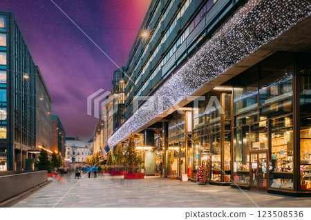 Helsinki, Finland. Shopping Center In New Year Lights Christmas Tree Decorations And Festive Illumination In Kaivokatu Street. Winter Xmas Holiday Season. Night stars shining above street Helsinki, Finland. Shopping Center In New Year Lights Christmas Tree Decorations And Festive Illumination In Kaivokatu Street. Winter Xmas Holiday Season. Night stars shining above street 123508536
