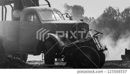 German World War Ii Automotive. German Military Ammunition. German Vehicle Truck Opel Blitz And German Infantry Cart Or Handcart Infanteriekarren If8 Of World War Ww Ii. Black And White Video 123508537