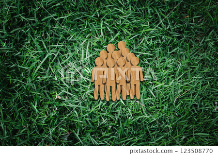 Sustainable Community: Wooden Group Icon on Grass Background Representing Eco-Friendly Social Responsibility 123508770