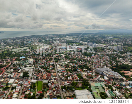Drone view of Iloilo City with houses and colonial churches. Panay Island. Philippines. Drone view of Iloilo City with houses and colonial churches. Panay Island. Philippines. 123508824