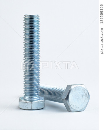 metallic bolts aligned on a white background 123509396