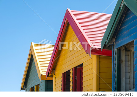 colorful beach houses, bathing boxes, change cubicles, at Muizenberg colorful beach houses, bathing boxes, change cubicles, at Muizenberg 123509415