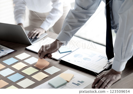 they have collected and transcribing it onto sticky color notes 123509654