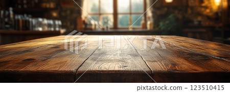 Wooden Table Surface with Sunset Blurry Cityscape and Nature Background, Warm Tones, and Soft Focus Lights Creating a Cozy Atmosphere for Relaxation 123510415