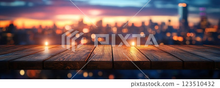 Wooden Table Surface with Sunset Blurry Cityscape and Nature Background, Warm Tones, and Soft Focus Lights Creating a Cozy Atmosphere for Relaxation Wooden Table Surface with Sunset Blurry Cityscape and Nature Background, Warm Tones, and Soft Focus Lights Creating a Cozy Atmosphere for Relaxation 123510432