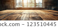 Wooden Table Surface with Sunset Blurry Cityscape and Nature Background, Warm Tones, and Soft Focus Lights Creating a Cozy Atmosphere for Relaxation 123510445