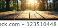 Wooden Table Surface with Sunset Blurry Cityscape and Nature Background, Warm Tones, and Soft Focus Lights Creating a Cozy Atmosphere for Relaxation 123510448