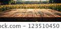 Wooden Table Surface with Sunset Blurry Cityscape and Nature Background, Warm Tones, and Soft Focus Lights Creating a Cozy Atmosphere for Relaxation 123510450