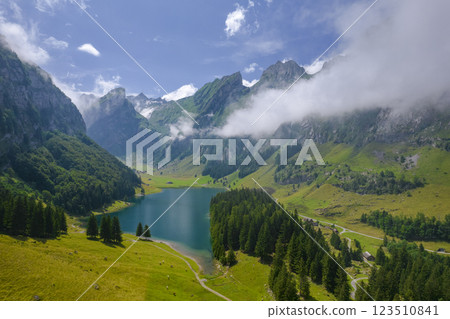 Aerial of beautiful mountain lake Seealpsee in Alps of Switzerland Sunny summer day Aerial of beautiful mountain lake Seealpsee in Alps of Switzerland Sunny summer day 123510841