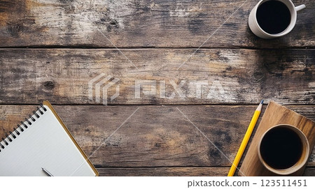 Blank sheet with pen, cup of coffee on wooden table.  123511451