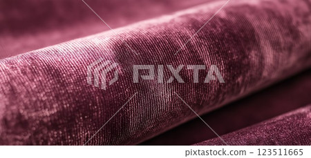 Shimmering Burgundy Velvet Fabric Roll Close-Up 123511665