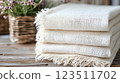 Stack of Cream Gauze Fabrics with Rustic Decor 123511702
