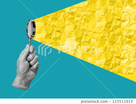 Hand holding magnifying glass over crumpled paper with beam of light. Search, investigation, zoom, Hand holding magnifying glass over crumpled paper with beam of light. Search, investigation, zoom, 123511913