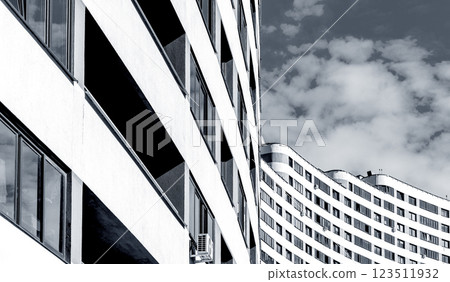 Modern architecture of multi-story highrise building with balconies and windows, offering a view of 123511932