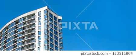 Modern multi-story high-rise building in city, residential property under development. Concrete Modern multi-story high-rise building in city, residential property under development. Concrete 123511964