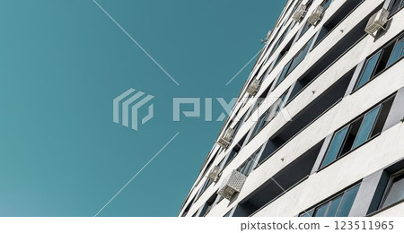 Modern multistorey apartment building in an urban neighborhood with efficient air conditioning and Modern multistorey apartment building in an urban neighborhood with efficient air conditioning and 123511965