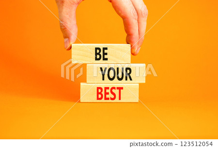 Motivational be your best symbol. Concept words Be your best on beautiful wooden blocks. Beautiful orange background. Businessman hand. Business motivational be your best concept. Copy space. Motivational be your best symbol. Concept words Be your best on beautiful wooden blocks. Beautiful orange background. Businessman hand. Business motivational be your best concept. Copy space. 123512054