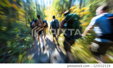 Fuzzy image of coworkers hiking together in the wilderness during the retreat Fuzzy image of coworkers hiking together in the wilderness during the retreat 123512119