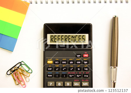 References or reference symbol. Concept word References on beautiful black calculator. Beautiful white paper background. Beautiful black pen. Business references or reference concept. Copy space. 123512137