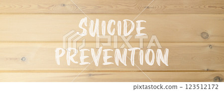 Suicide prevention symbol. Concept words Suicide prevention on beautiful wooden wall. Beautiful wooden wall background. Psychological and suicide prevention concept. Copy space. 123512172