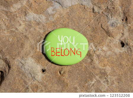 Belonging and you belong symbol. Concept words You belong on beautiful green stone. Beautiful brown stone background. Business belonging and you belong concept. Copy space. 123512208