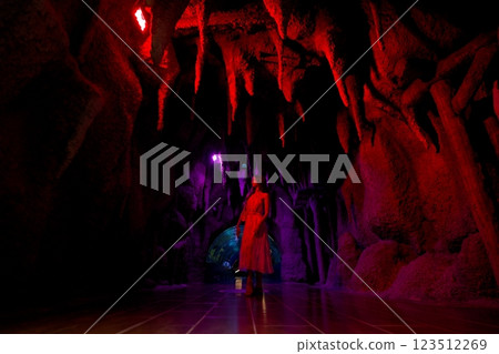 Woman Exploring Colorful Cave Exhibit at Antalya Aquarium Woman Exploring Colorful Cave Exhibit at Antalya Aquarium 123512269