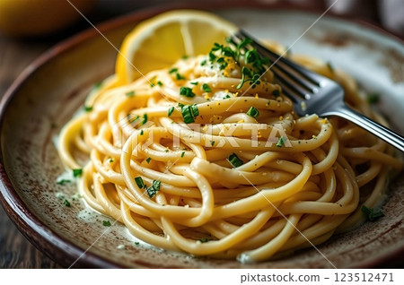 Luxurious Italian Fettuccine in Silky Cream Sauce with Fresh Herbs and Citrus Accents 123512471