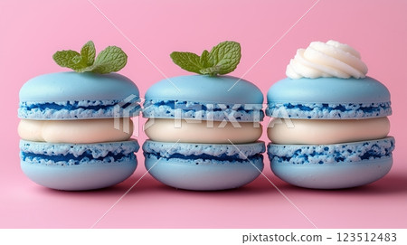 Valentine's Day macrons with red and pink cream, white chocolate filling, and hazelnuts on top.  123512483